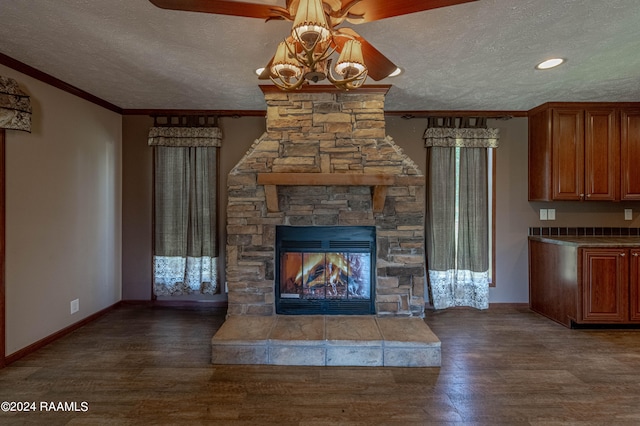 unfurnished living room featuring ornamental molding, a textured ceiling, and dark hardwood / wood-style flooring