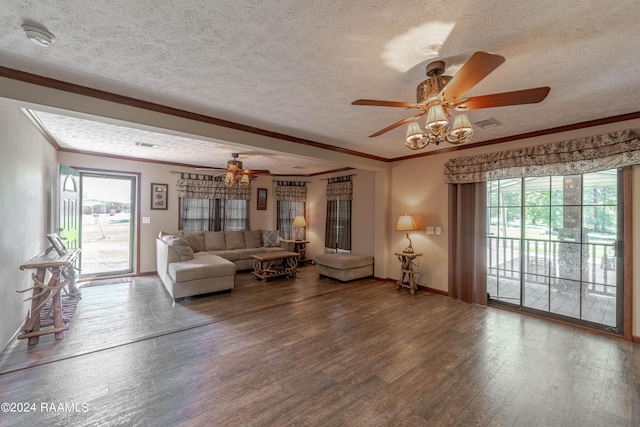 unfurnished living room with hardwood / wood-style floors, a textured ceiling, and a wealth of natural light