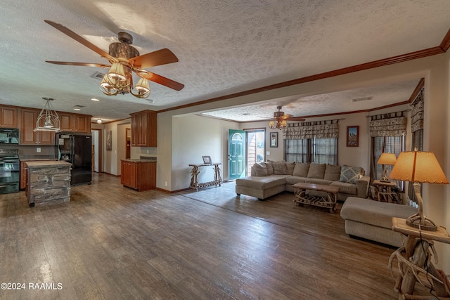 living room featuring ornamental molding, a textured ceiling, dark hardwood / wood-style floors, and ceiling fan