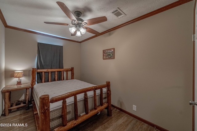 bedroom with dark hardwood / wood-style flooring, crown molding, a textured ceiling, and ceiling fan