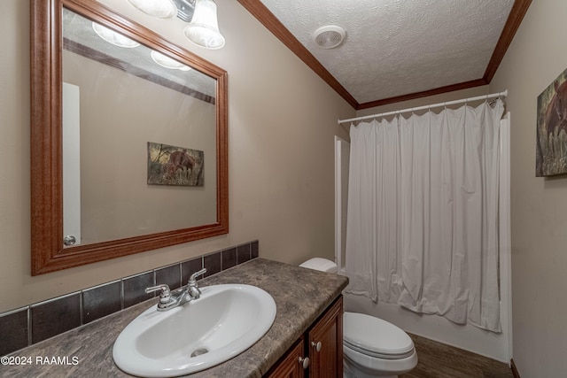 full bathroom featuring a textured ceiling, toilet, shower / bath combo with shower curtain, vanity, and ornamental molding