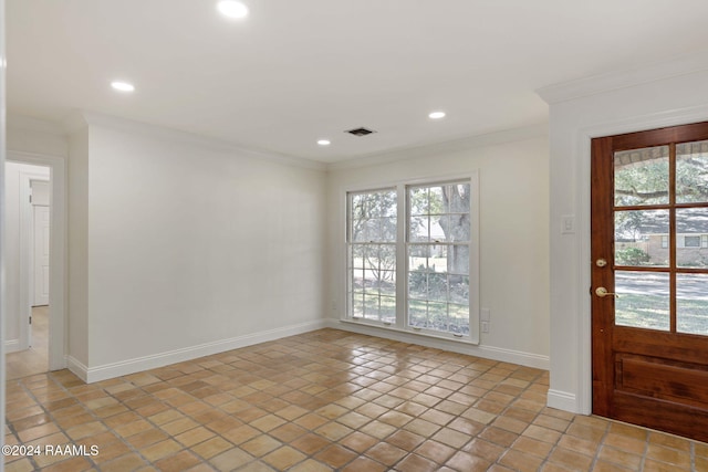 interior space with a wealth of natural light, ornamental molding, and light tile patterned floors