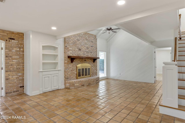 unfurnished living room with light tile patterned floors, ceiling fan, built in features, a fireplace, and lofted ceiling with beams