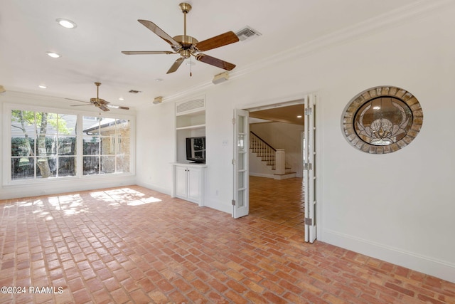 unfurnished living room with ornamental molding and ceiling fan