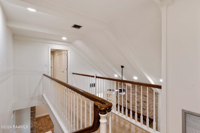 staircase with vaulted ceiling