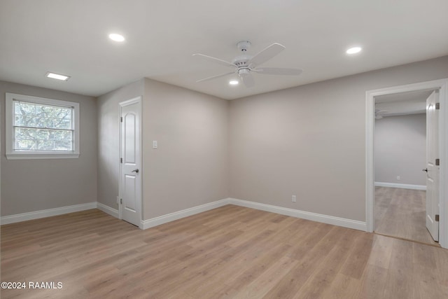 unfurnished room with light hardwood / wood-style floors and ceiling fan