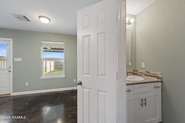 bathroom featuring vanity and concrete floors