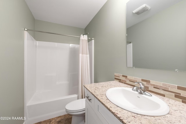 full bathroom with shower / bath combo, toilet, vanity, and tasteful backsplash