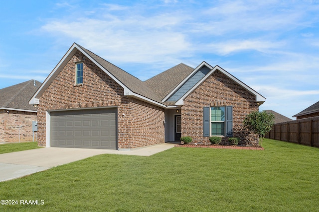 front facade with a garage and a front lawn