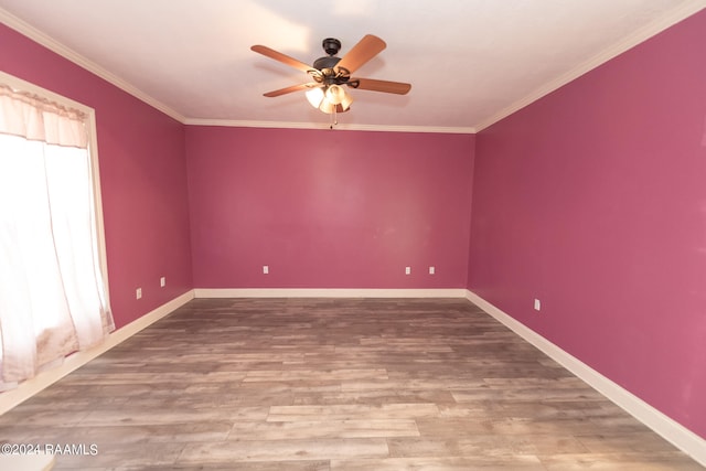 spare room with crown molding, hardwood / wood-style flooring, and ceiling fan