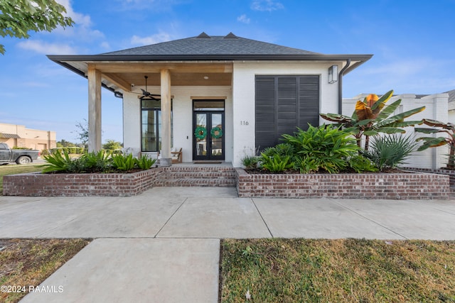 view of exterior entry featuring french doors