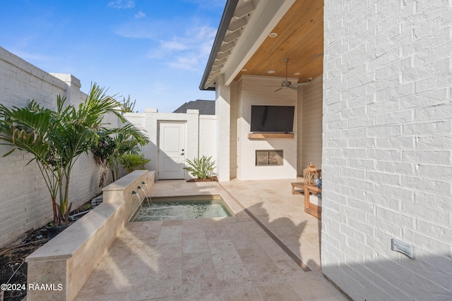 view of patio featuring ceiling fan