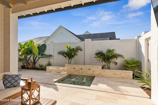 view of patio with a hot tub