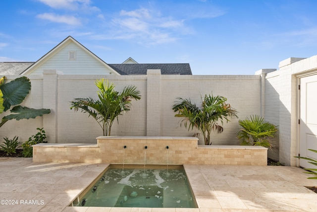 view of patio / terrace featuring a hot tub