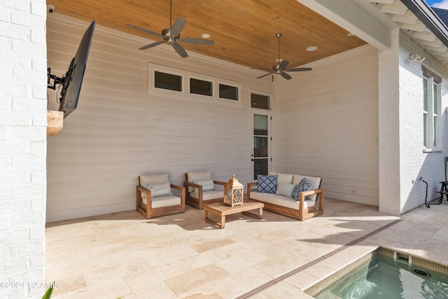 view of patio / terrace with a hot tub, outdoor lounge area, and ceiling fan