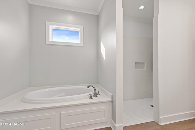 bathroom featuring separate shower and tub, crown molding, and wood-type flooring