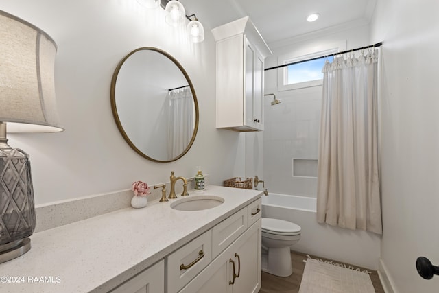 full bathroom featuring hardwood / wood-style flooring, toilet, shower / bath combination with curtain, crown molding, and vanity