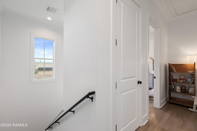 hall featuring crown molding and wood-type flooring