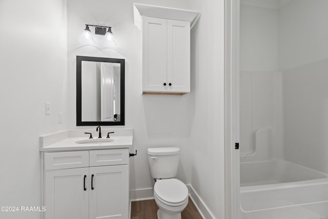 full bathroom with vanity, toilet, shower / bath combination, and hardwood / wood-style floors