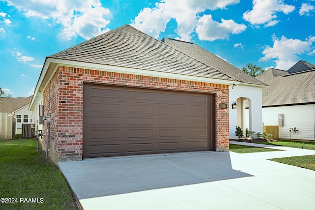 204 Treescape Dr, Lafayette, LA 70508 - garage featuring concrete driveway and cooling unit