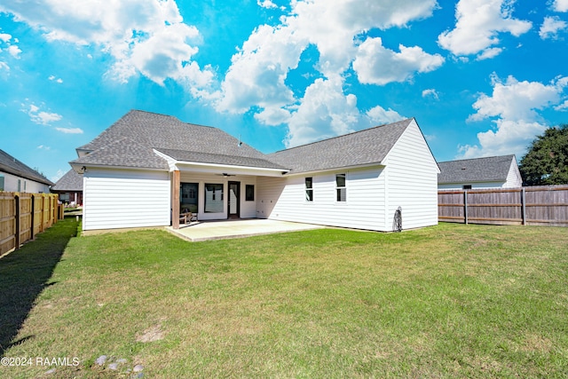 rear view of house featuring a patio area, a lawn, and ceiling fan