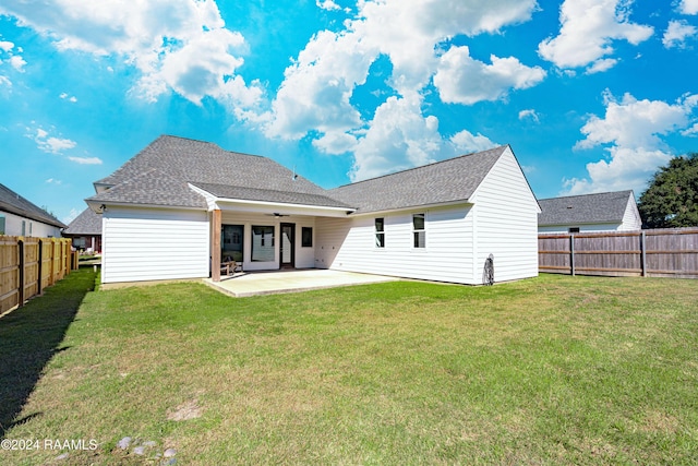 204 Treescape Dr, Lafayette, LA 70508 - rear view of property featuring ceiling fan, a patio, a fenced backyard, roof with shingles, and a lawn