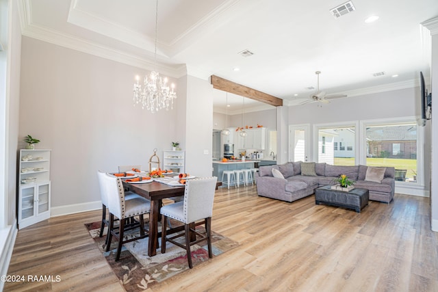 dining area with ornamental molding, hardwood / wood-style floors, and ceiling fan with notable chandelier