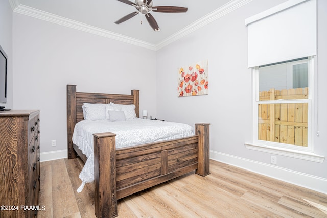 bedroom featuring ceiling fan, hardwood / wood-style flooring, and ornamental molding