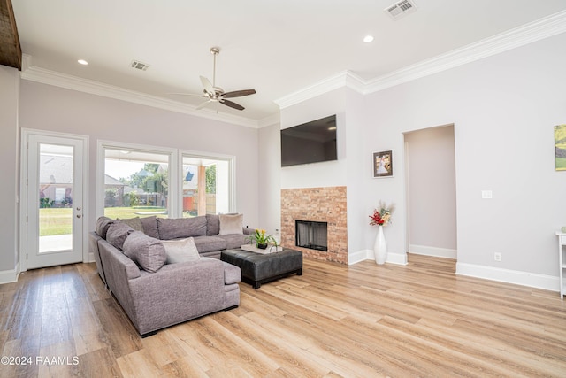204 Treescape Dr, Lafayette, LA 70508 - living room with visible vents, ornamental molding, light wood-style flooring, and a ceiling fan