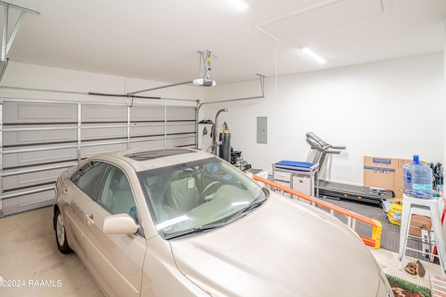 garage featuring a garage door opener and electric panel