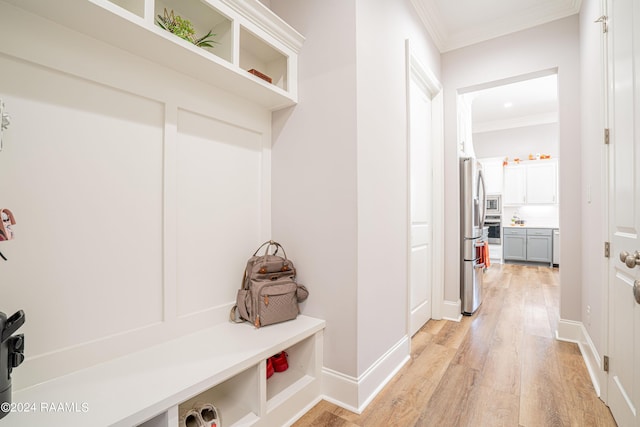 204 Treescape Dr, Lafayette, LA 70508 - mudroom featuring light wood-type flooring, ornamental molding, and baseboards