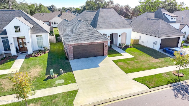 view of front of home with a front lawn and a garage