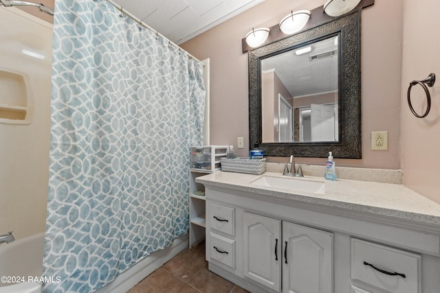 bathroom featuring vanity, shower / bathtub combination with curtain, and tile patterned floors