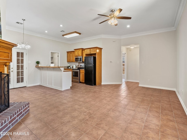 kitchen with kitchen peninsula, stainless steel appliances, crown molding, a fireplace, and ceiling fan with notable chandelier