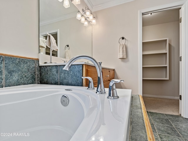 bathroom with ornamental molding, sink, and a tub