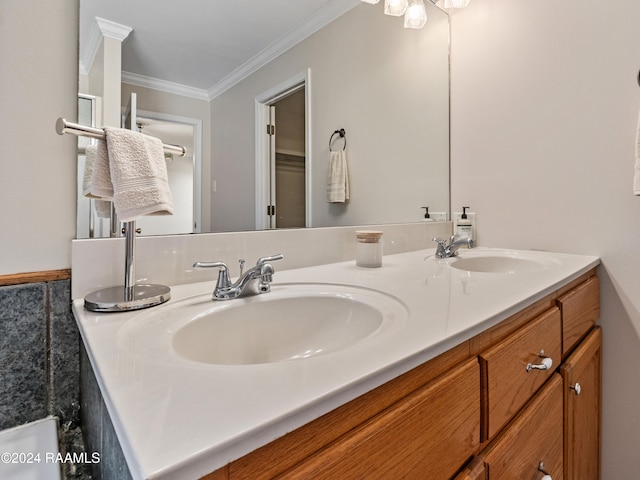 bathroom with vanity and ornamental molding