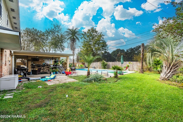 view of yard featuring a fenced in pool and a patio