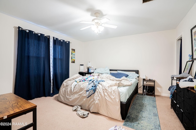 bedroom with ceiling fan and carpet