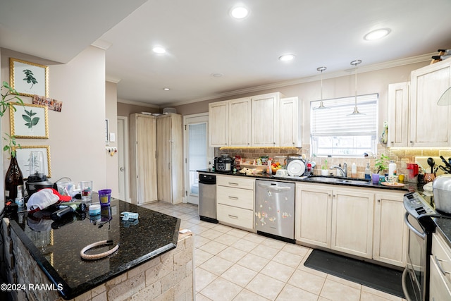 kitchen featuring sink, tasteful backsplash, stainless steel appliances, and dark stone countertops