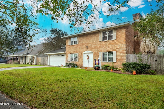 view of front of home featuring a garage and a front lawn