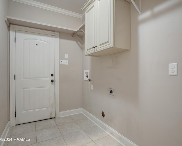 washroom featuring cabinets, washer hookup, light tile patterned floors, hookup for an electric dryer, and crown molding