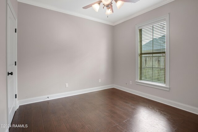 unfurnished room with dark wood-type flooring, ceiling fan, and crown molding