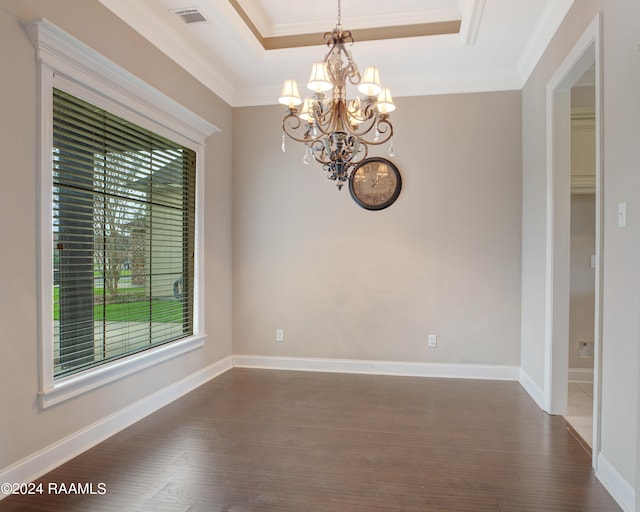 unfurnished room with dark wood-type flooring, a chandelier, a healthy amount of sunlight, and ornamental molding