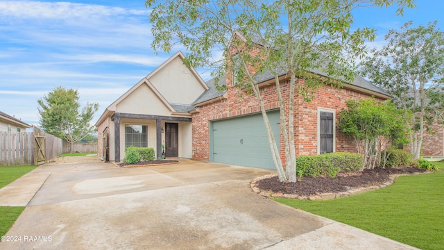 front facade featuring a garage and a front yard