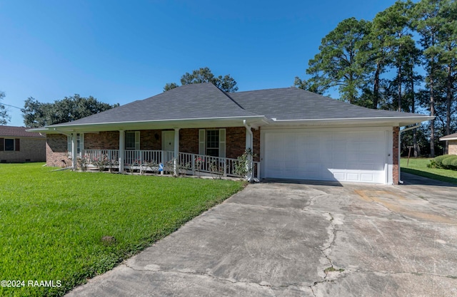 ranch-style home featuring a garage, a front yard, and a porch