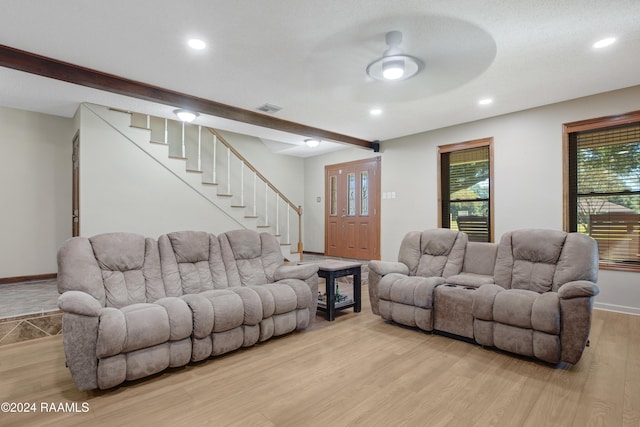 living area with ceiling fan, stairway, baseboards, recessed lighting, and light wood-style flooring