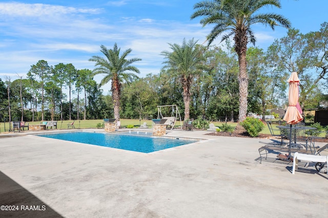outdoor pool with a patio