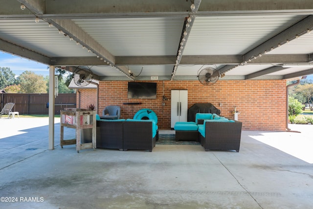 view of patio with fence and an outdoor hangout area