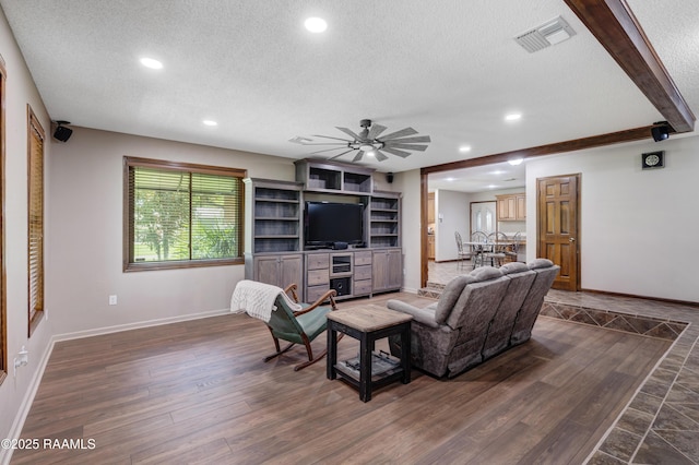 415 Kyle Landry Rd, New Iberia, LA 70563 - living room featuring a textured ceiling, baseboards, recessed lighting, dark wood-style flooring, and a ceiling fan