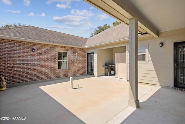 view of patio featuring a grill